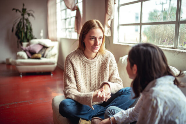 Mother and daughter having a talk at home